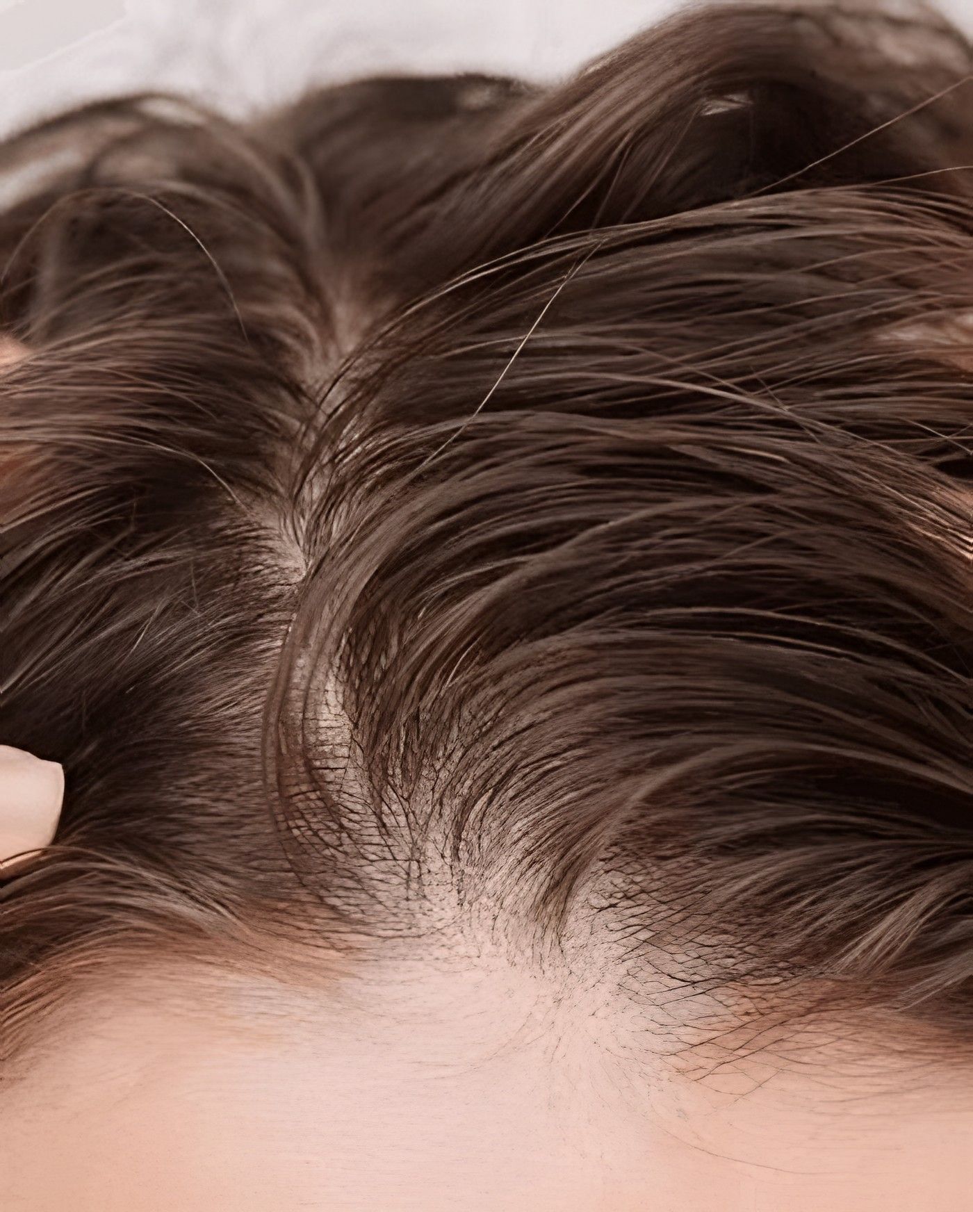 Close-up of a hair parting and scalp
