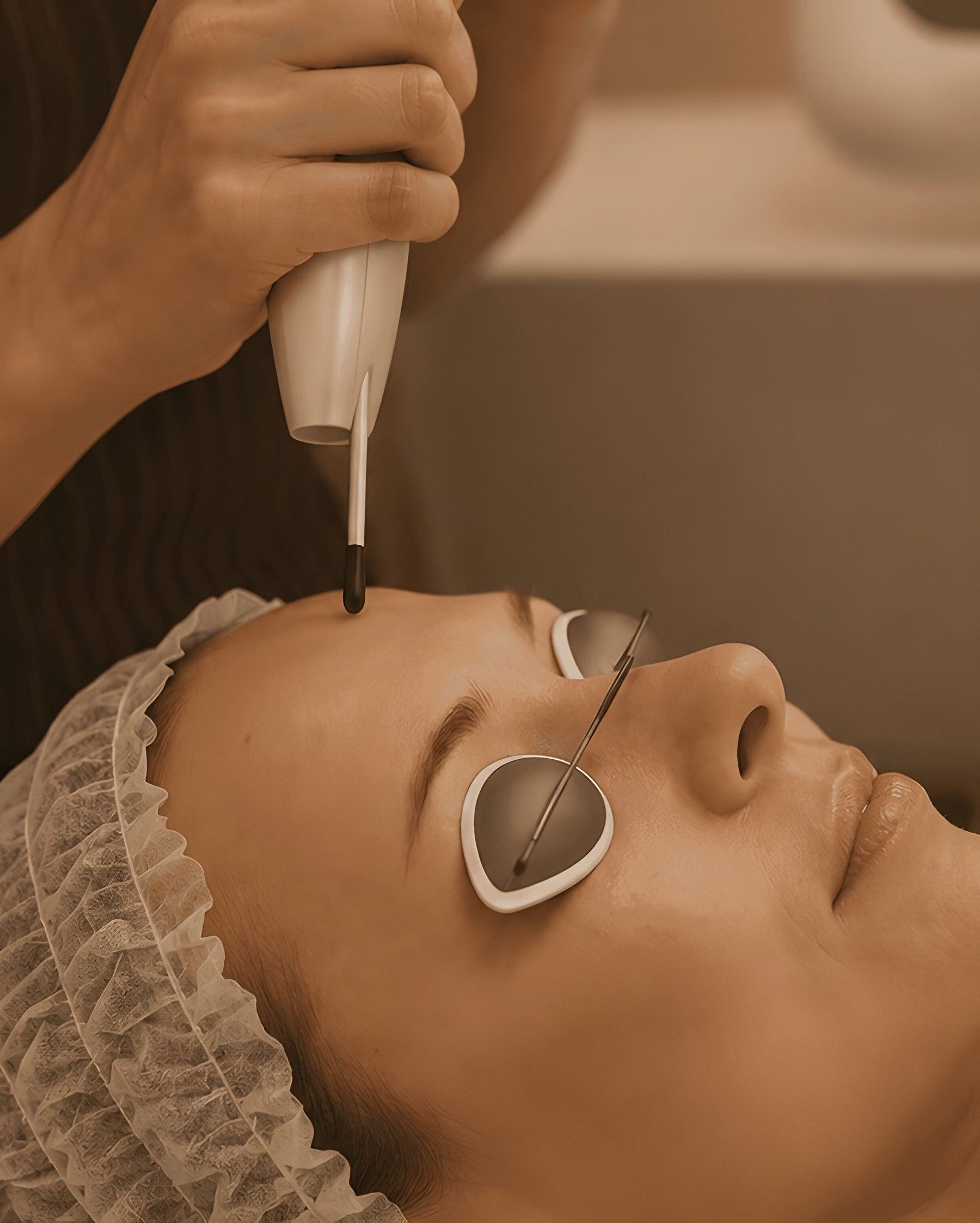 Client wearing protective eyewear during a laser-based medi-facial